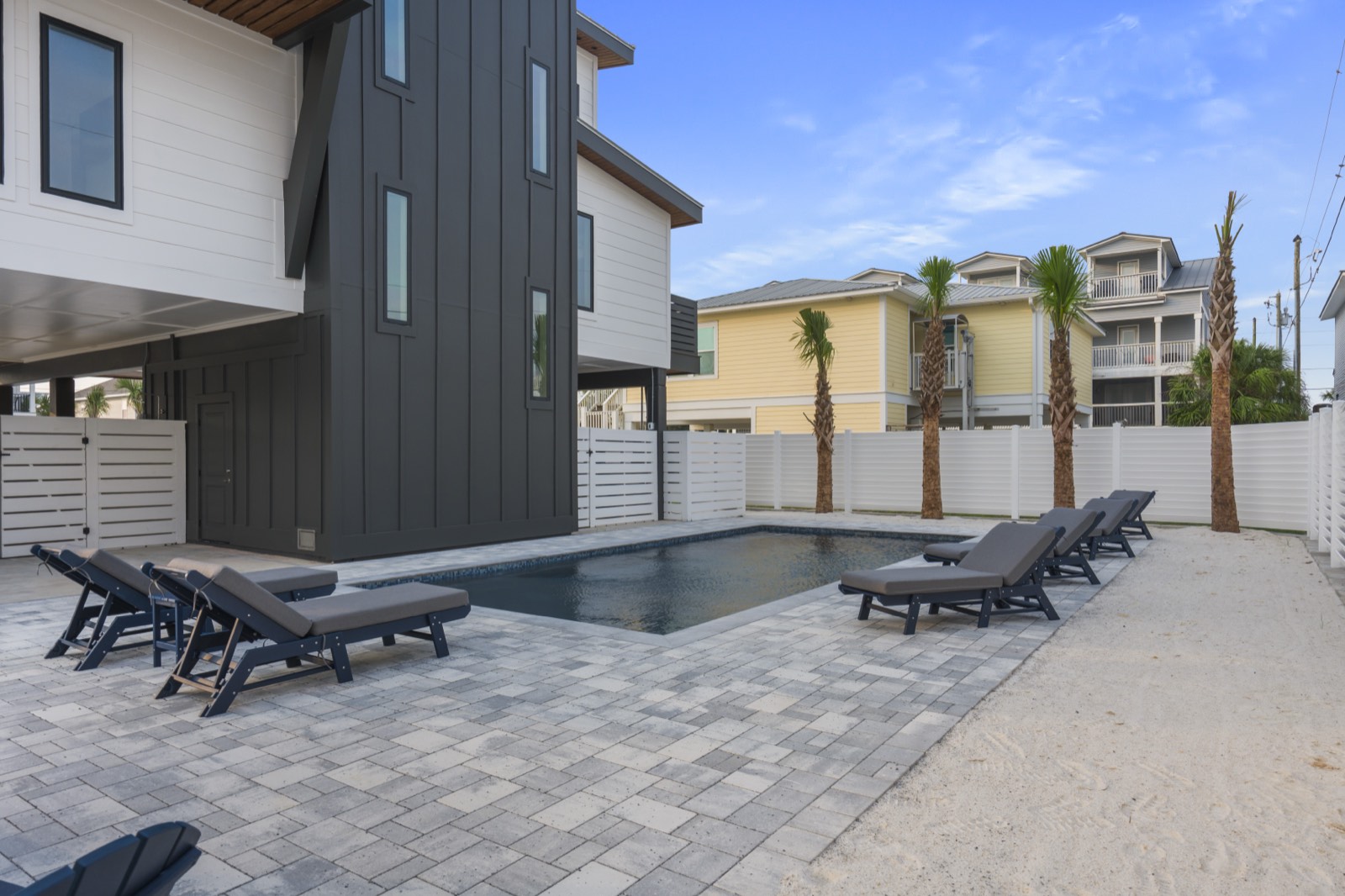 Private pool and loungers beside the home